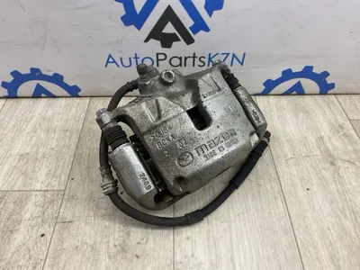 Суппорт тормозной Mazda 3 BP PY перед. прав. (б/у)