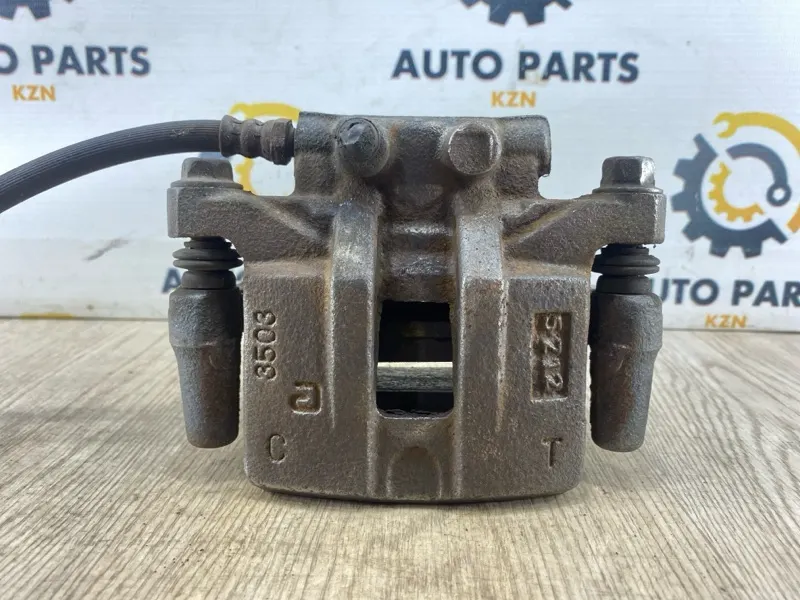 Суппорт тормозной Mitsubishi Outlander XL 4B12/2.4Л задн. лев. (б/у)